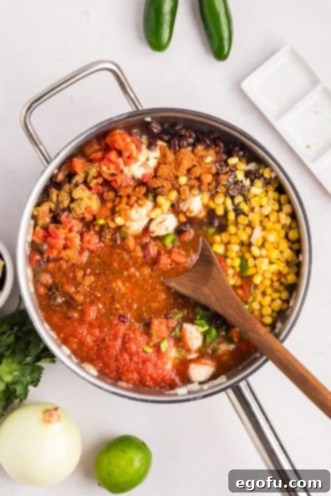 Everything for Chicken Taco Soup in a skillet.