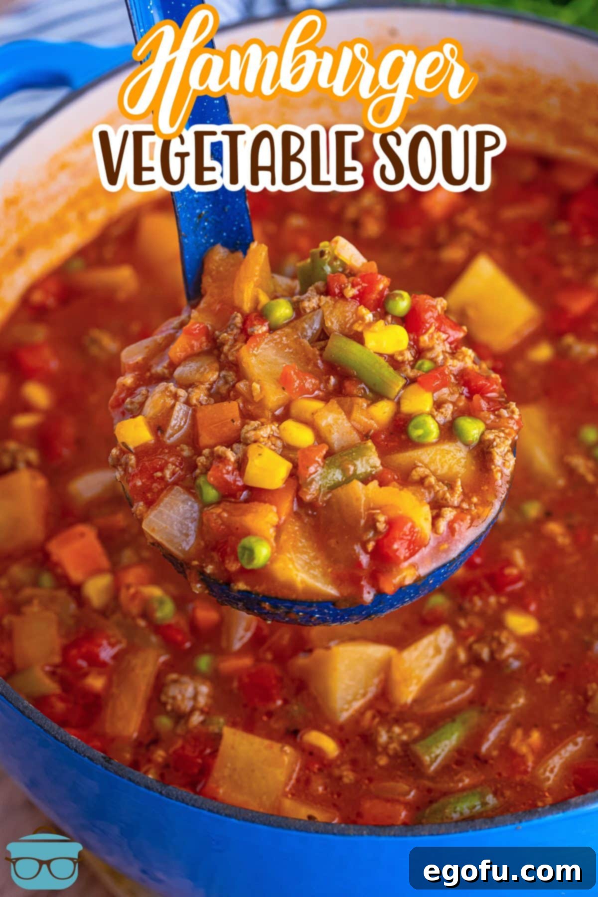 A ladle in a pot of Hamburger Vegetable Soup.