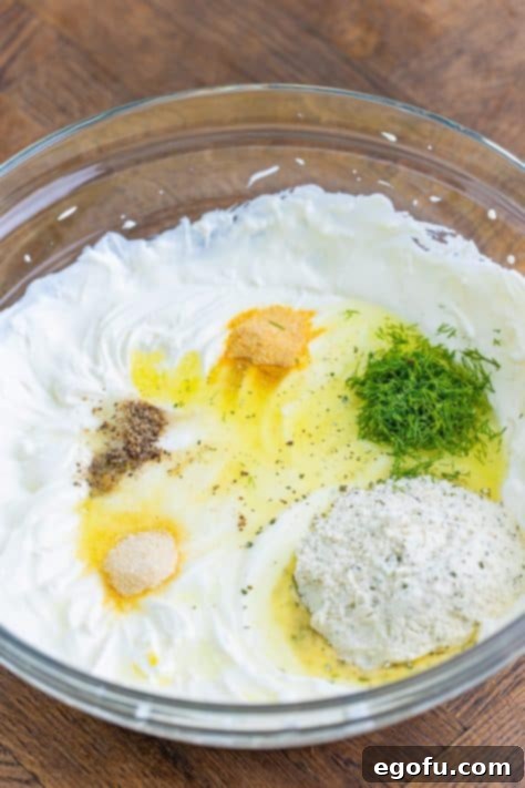 All creamy ingredients and seasonings mixed in a bowl.