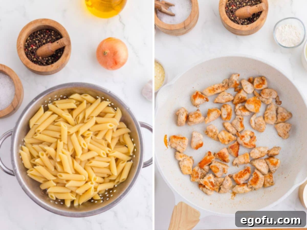 Cooked pasta in a strainer and cooked chicken in a pan.