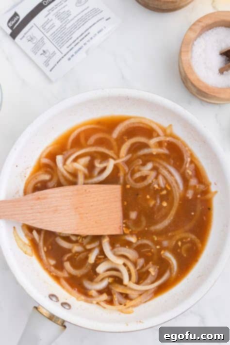 Caramelized Onion Smothered Pork Chops 14 Onions, garlic, seasonings, and beef broth in a skillet.