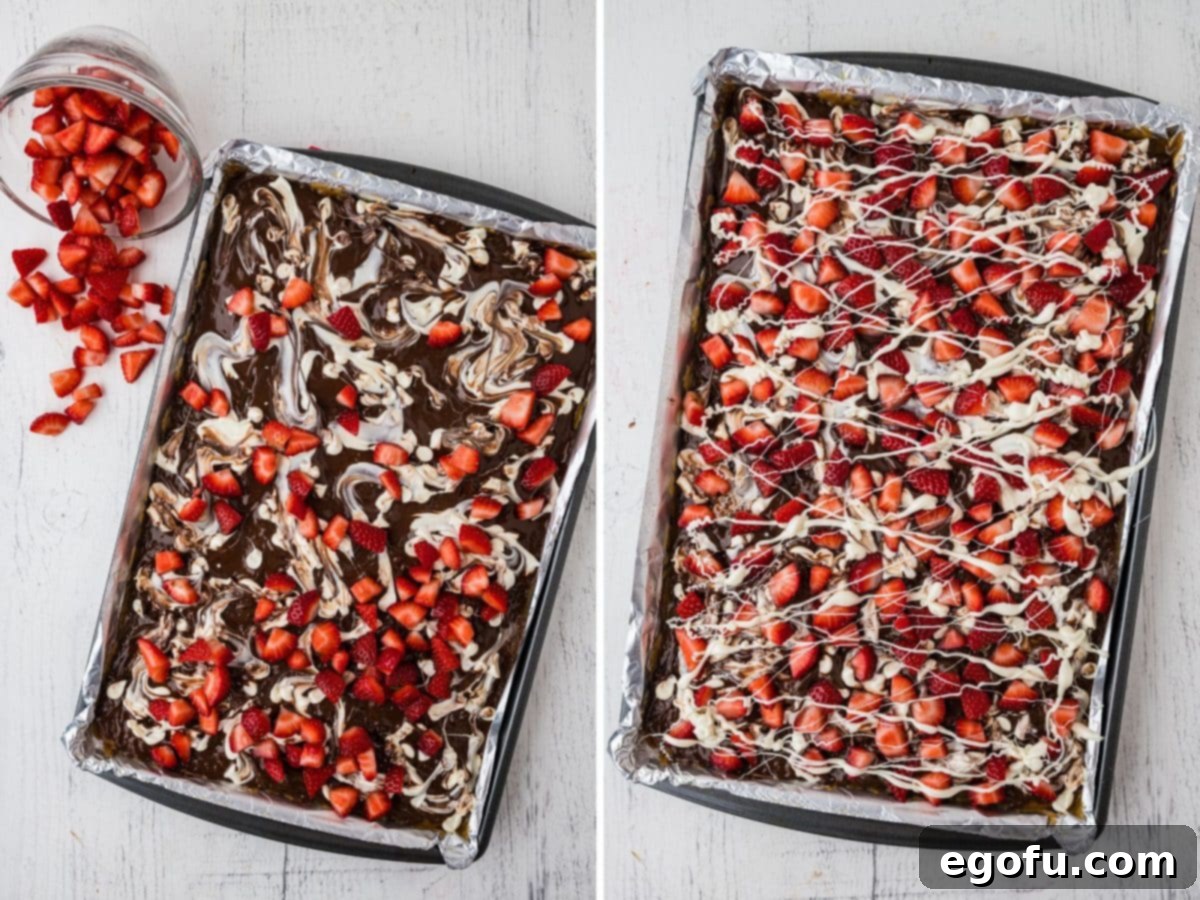 Decadent Strawberry Chocolate Bark 7 A close-up of strawberries scattered on the chocolate bark, and a freshly made, fully set chocolate and strawberry bark ready to be broken.