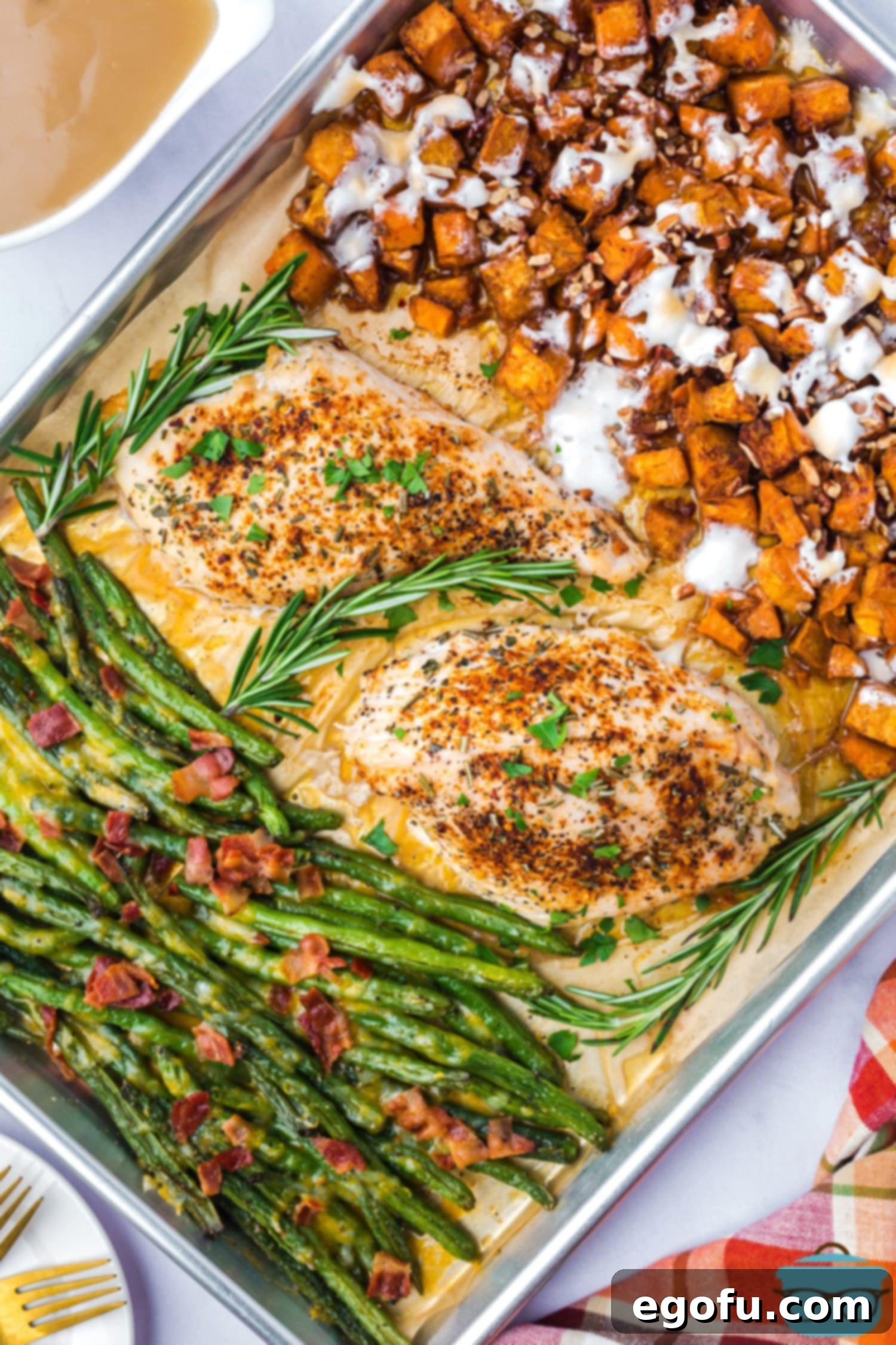 A beautifully arranged full turkey dinner on a single sheet pan, ready to serve.