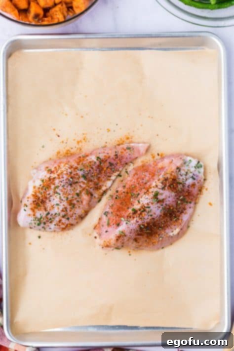 Seasoned turkey on a parchment paper.