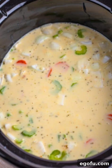 A Crock pot with the beginning of stew.