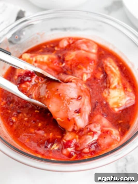 Chicken coated in sauce.