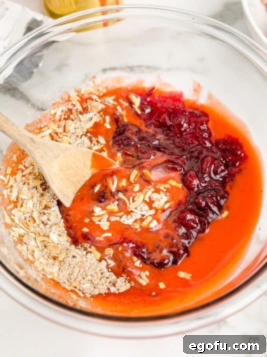 A bowl with catalina dressing, dry onion soup mix and whole cranberry sauce.