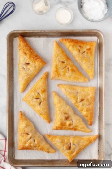 Fresh baked apple turnovers, golden and flaky.