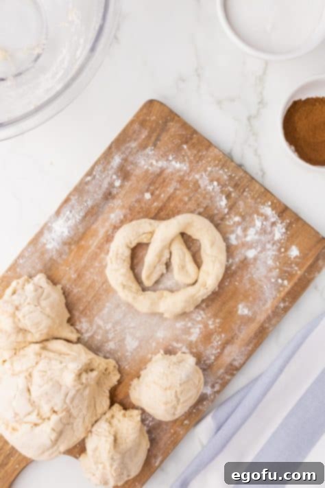 Pretzel dough on a board.