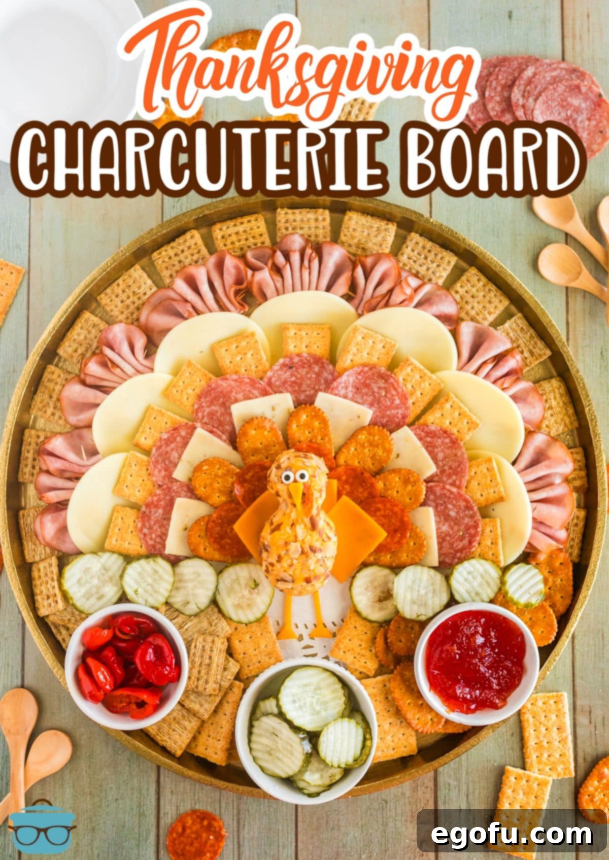 A charming turkey-inspired Thanksgiving Charcuterie Board, fully assembled with layers of meats, cheeses, and crackers.