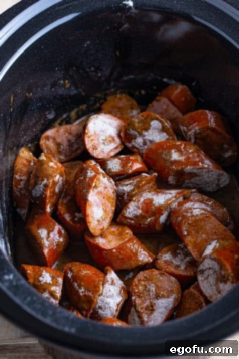 Seasoned kielbasa in a crockpot.