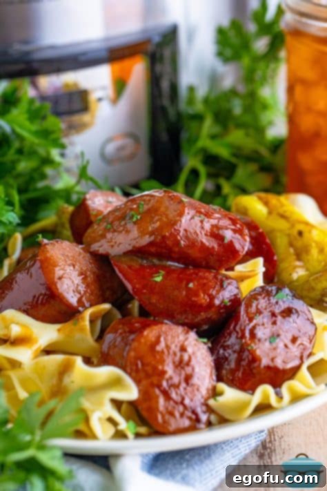 A plate of Slow Cooker Kielbasa with pasta.