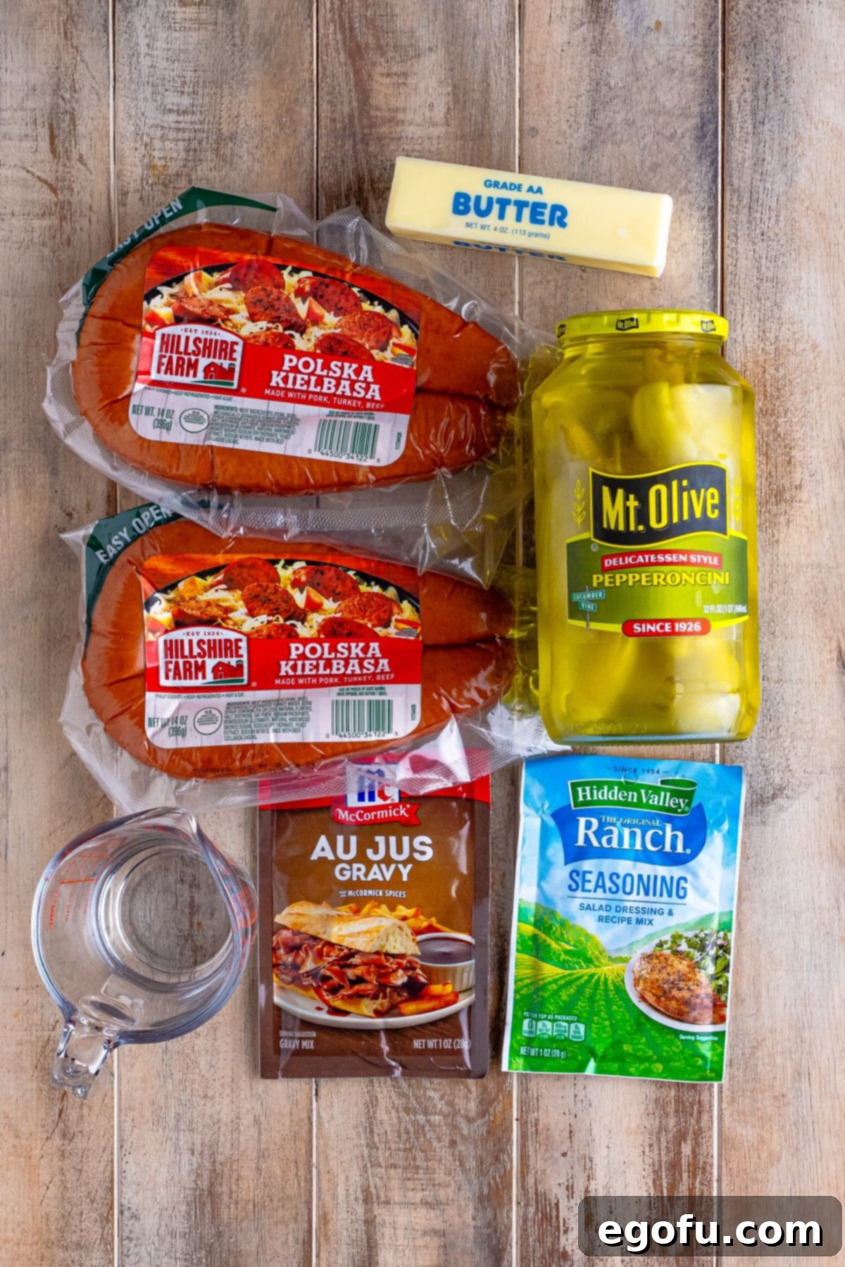 Kielbasa, pepperoncini, ranch dry seasoning, au jus gravy, and water. 