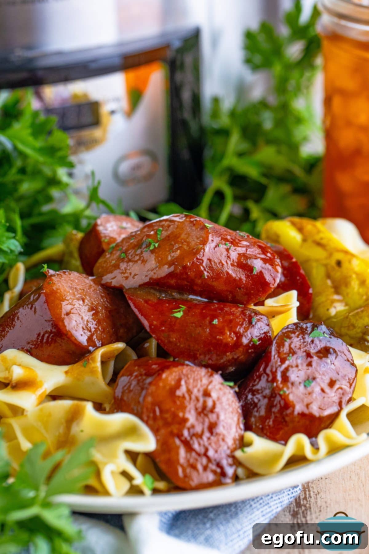 A plate of Slow Cooker Kielbasa with pasta. 