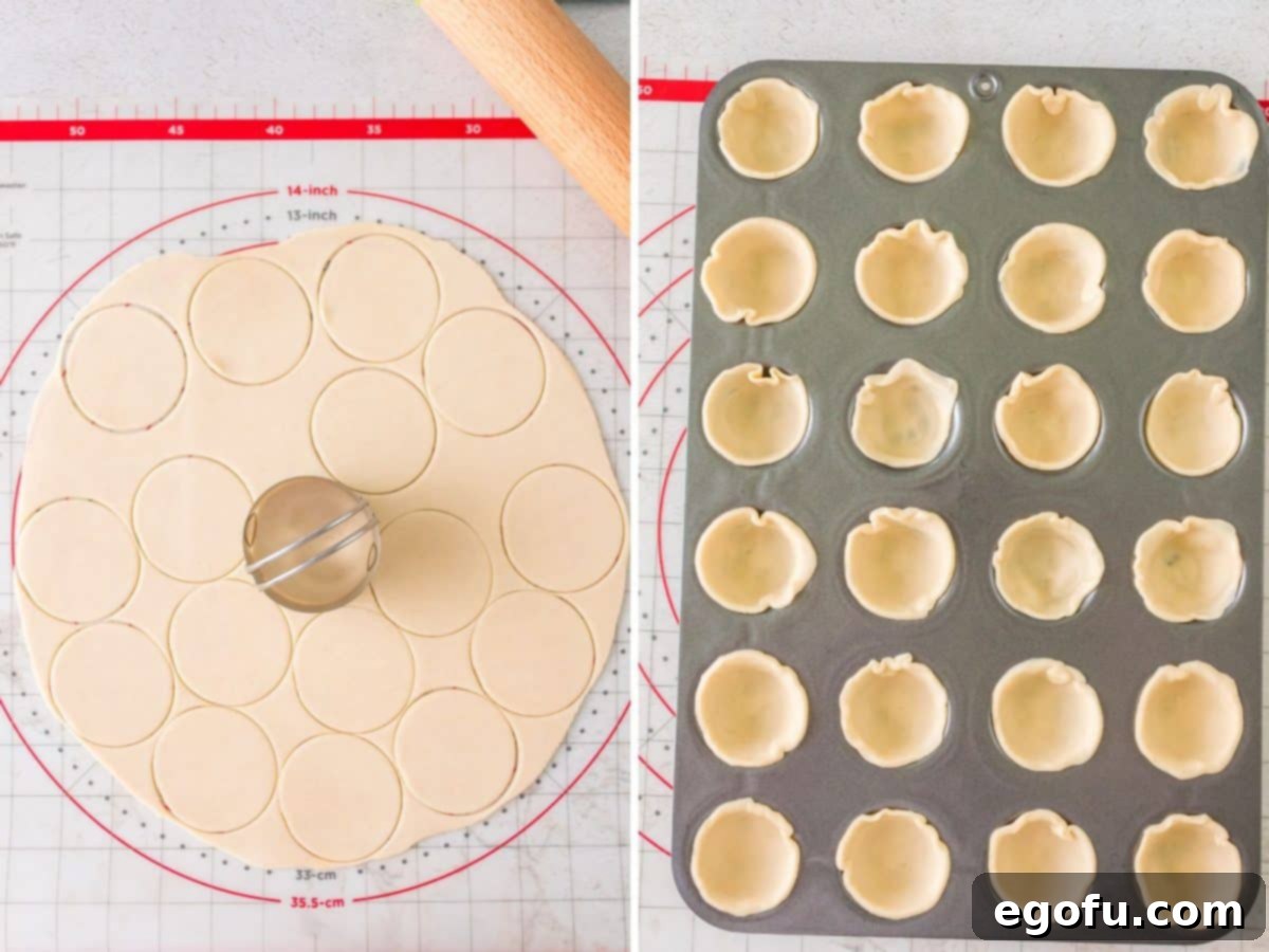 A rolled out pie crust being cut into smaller circles with a cookie cutter, and a muffin pan already lined with dough circles, showing the next step in making the mini pies.