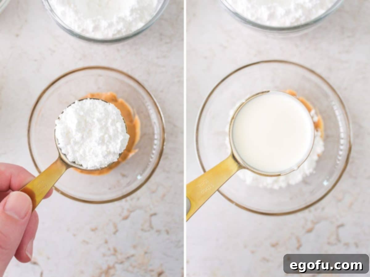 A measuring cup of powdered sugar being added to peanut butter, followed by heavy cream being poured into the mixture, ready for blending to create the filling.