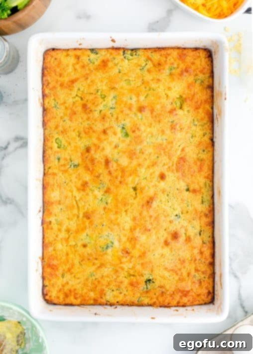 Homestyle Broccoli Cheddar Cornbread 16 Baked Broccoli Cheese Cornbread in a dish.