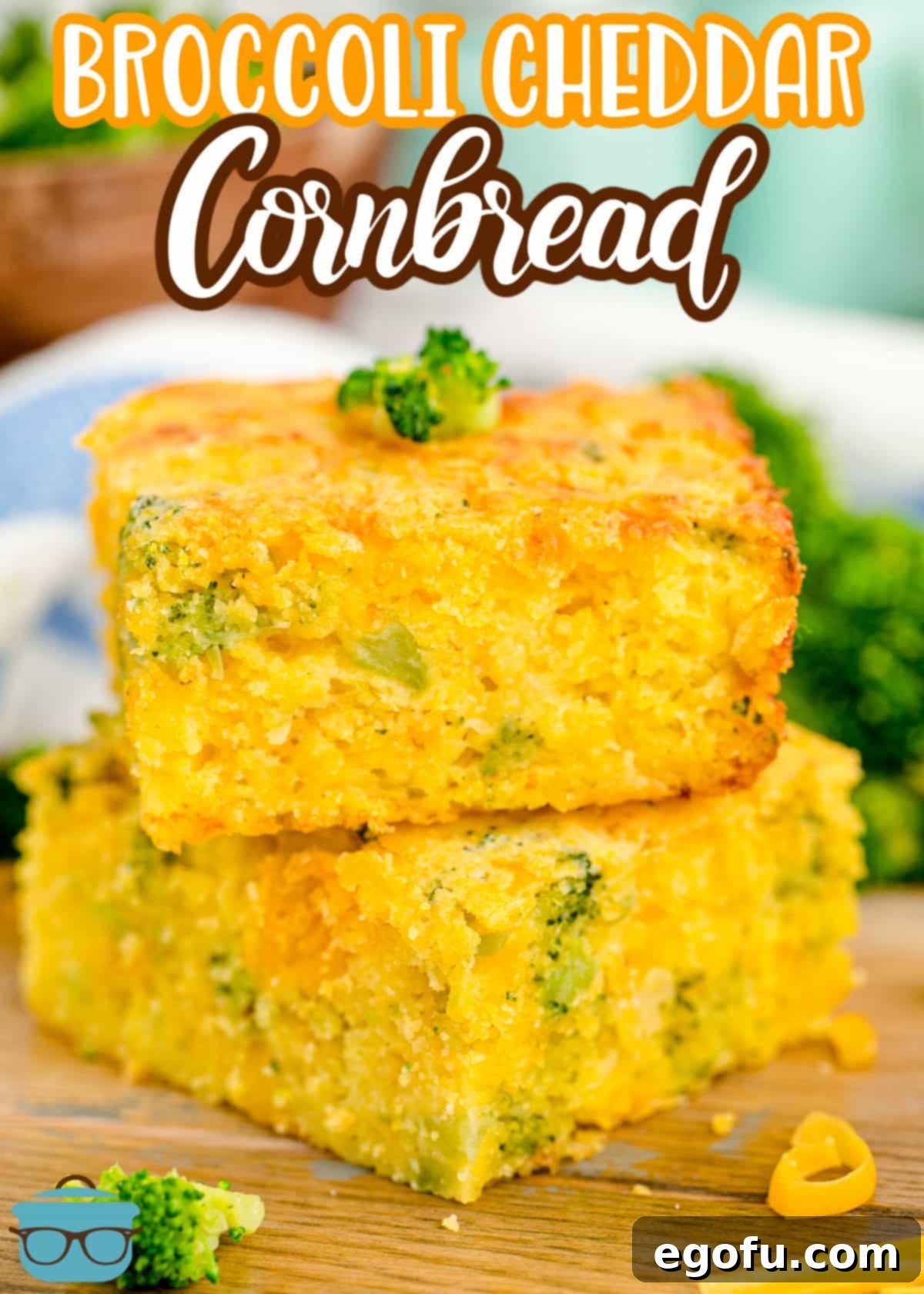 Homestyle Broccoli Cheddar Cornbread 4 A perfectly baked slice of Broccoli Cheddar Cornbread on top of another slice, showcasing its moist texture and cheesy interior.