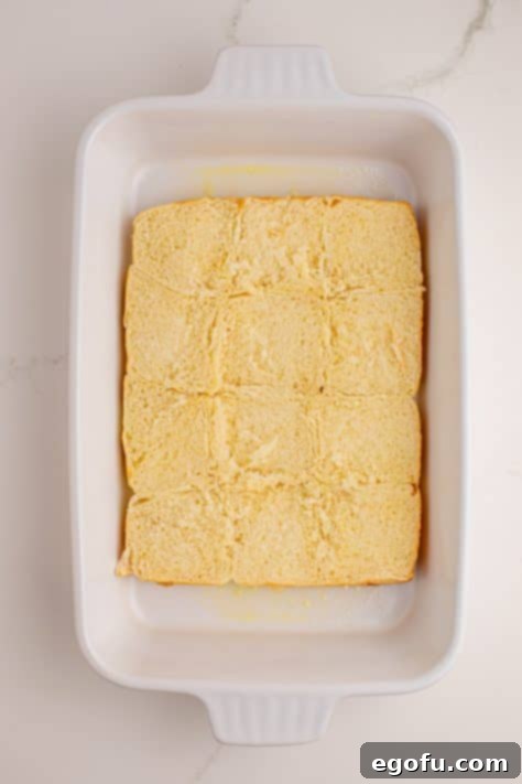 Zesty BBQ Chicken Sliders 9 Bottoms of Hawaiian rolls in a casserole dish.