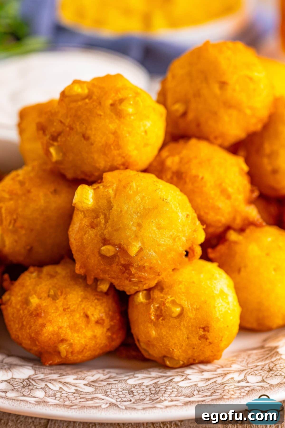 Sweet Corn Fritters 2 A small pile of golden-brown Sweet Corn Fritters, perfectly fried and ready to enjoy.