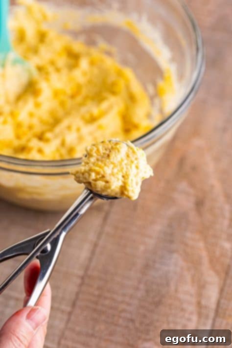 Sweet Corn Fritters 14 A scoop holding some Corn Fritter batter.