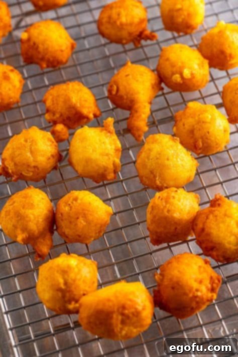 Sweet Corn Fritters 15 A wire rack with fresh fried Corn Fritters.