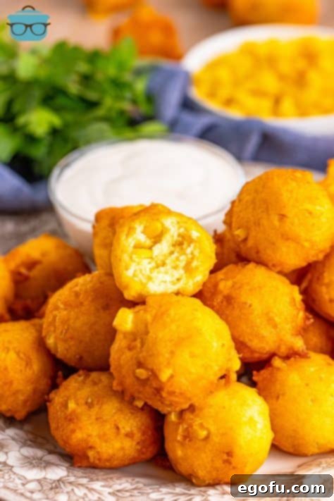 Sweet Corn Fritters 16 A few Corn Fritters with one bit in half.