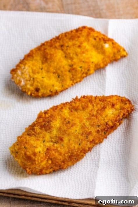 California Stuffed Chicken 18 Breaded and cooked chicken on a paper towel.