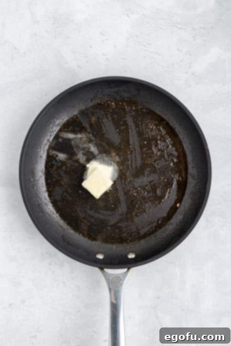 A skillet with olive oil and butter.