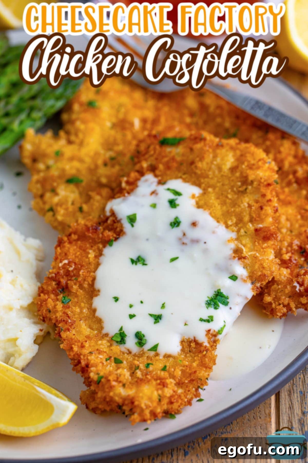 Close-up of a few pieces of perfectly golden-brown Chicken Costoletta, with a generous drizzle of the creamy lemon sauce on one piece, highlighting its inviting texture and rich appeal, ready to be served.