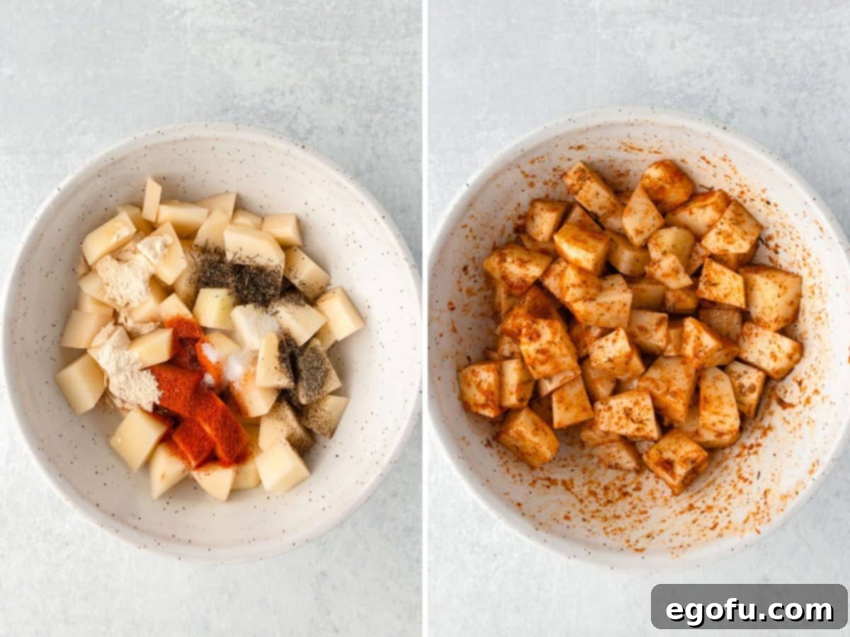 Crispy Air Fryer Breakfast Potatoes 5 A bowl of cubed potatoes with olive oil, paprika, garlic powder, onion powder, thyme, salt, and pepper and another bowl with seasoned raw potatoes, illustrating the seasoning process.