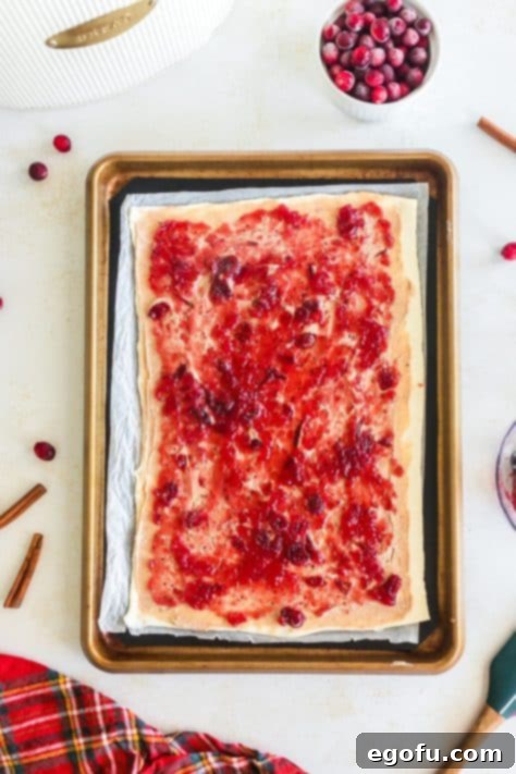 Cranberry sauce over cream cheese mixture on puff pastry.