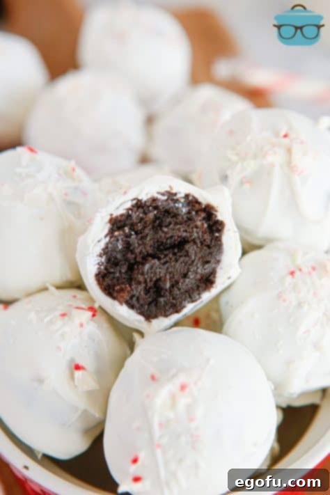 A half eaten Peppermint Oreo Ball on top of the rest of them.