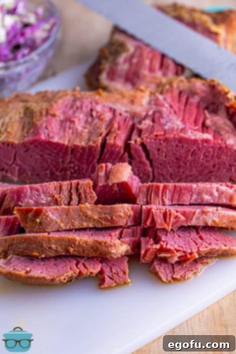 Set-It-and-Forget-It Corned Beef 15 Sliced corned beef on a cutting board, ready for serving.