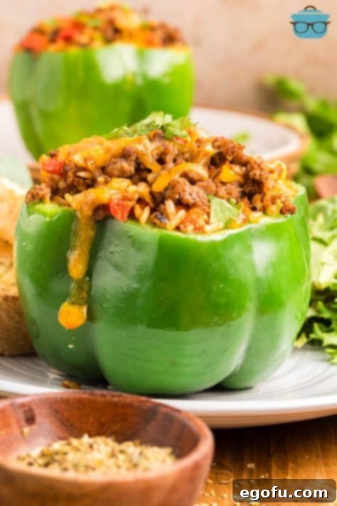 A green bell pepper overflowing with stuffed pepper stuffing.