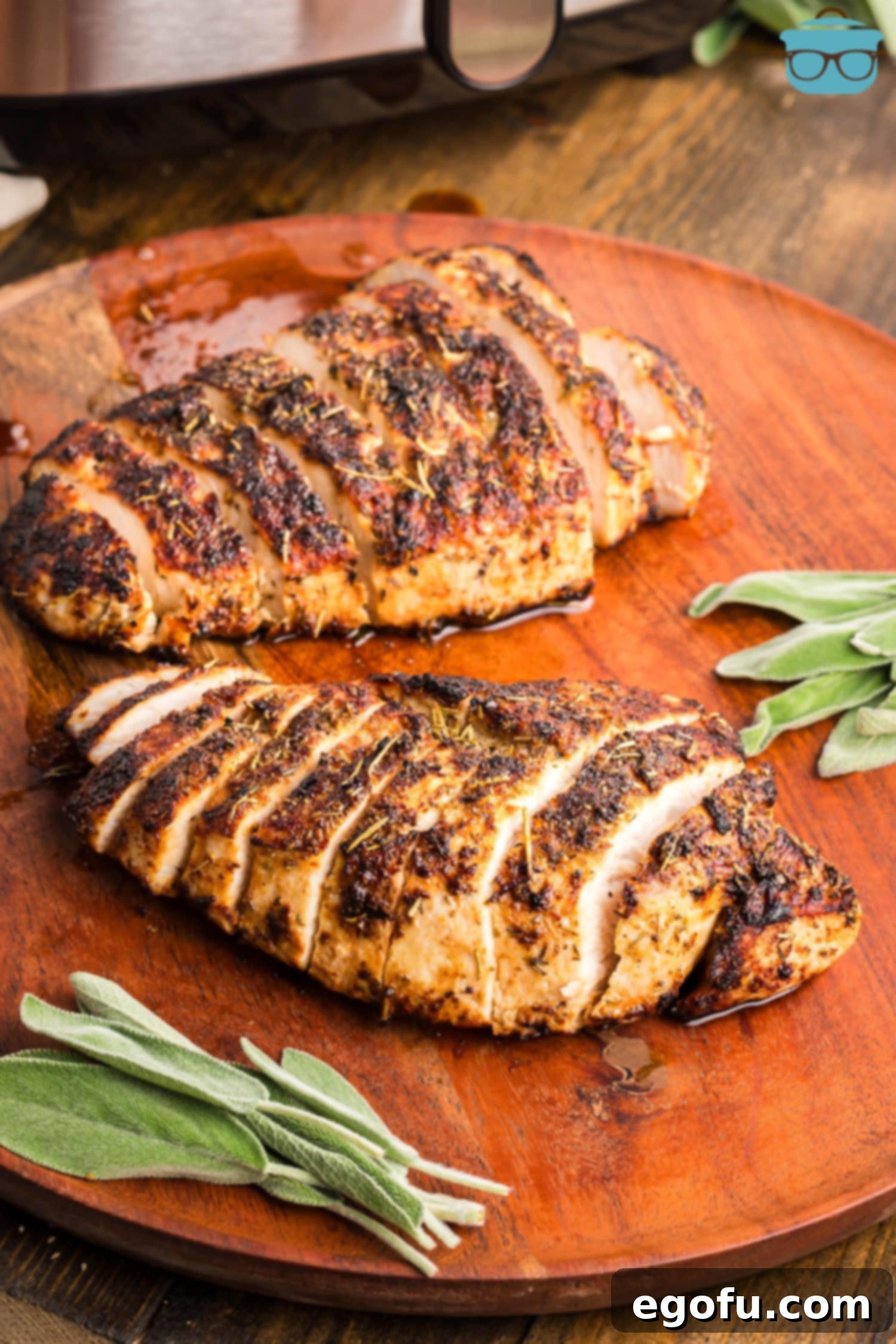 Flavorful Air Fryer Turkey Tenderloin 2 Sliced Air Fryer Turkey Tenderloins on a cutting board.