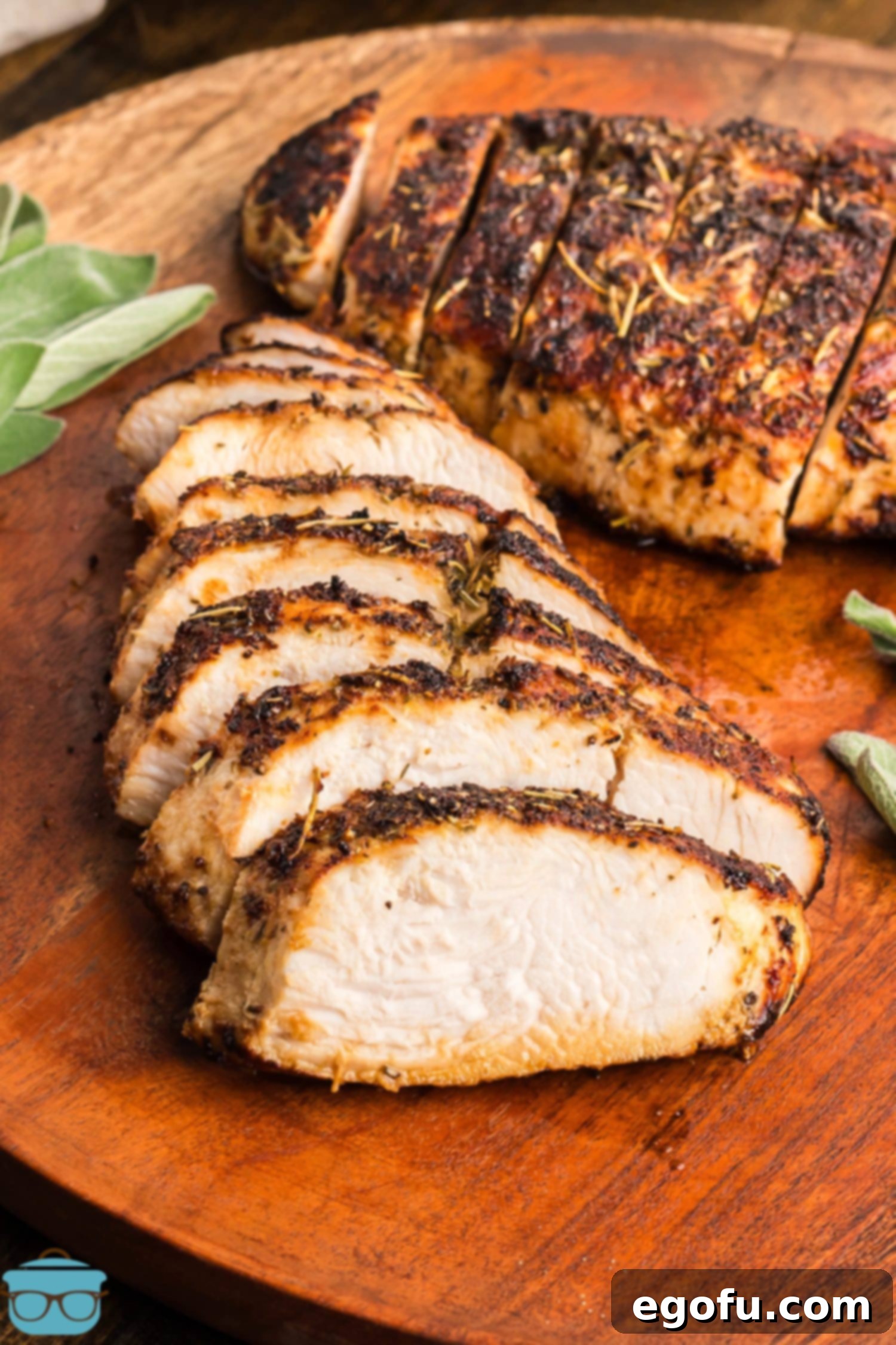 Flavorful Air Fryer Turkey Tenderloin 7 A sliced up Turkey Tenderloin on a cutting board.
