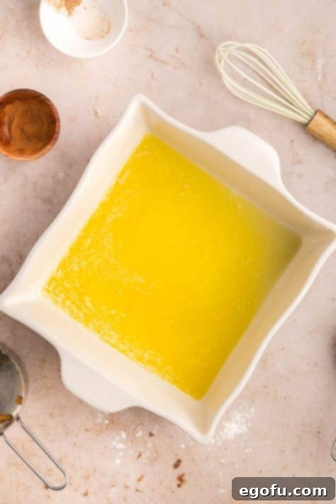 Melted butter in a baking dish.