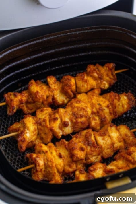 Cooked Air Fryer Chicken Skewers with a garlic parmesan sauce.