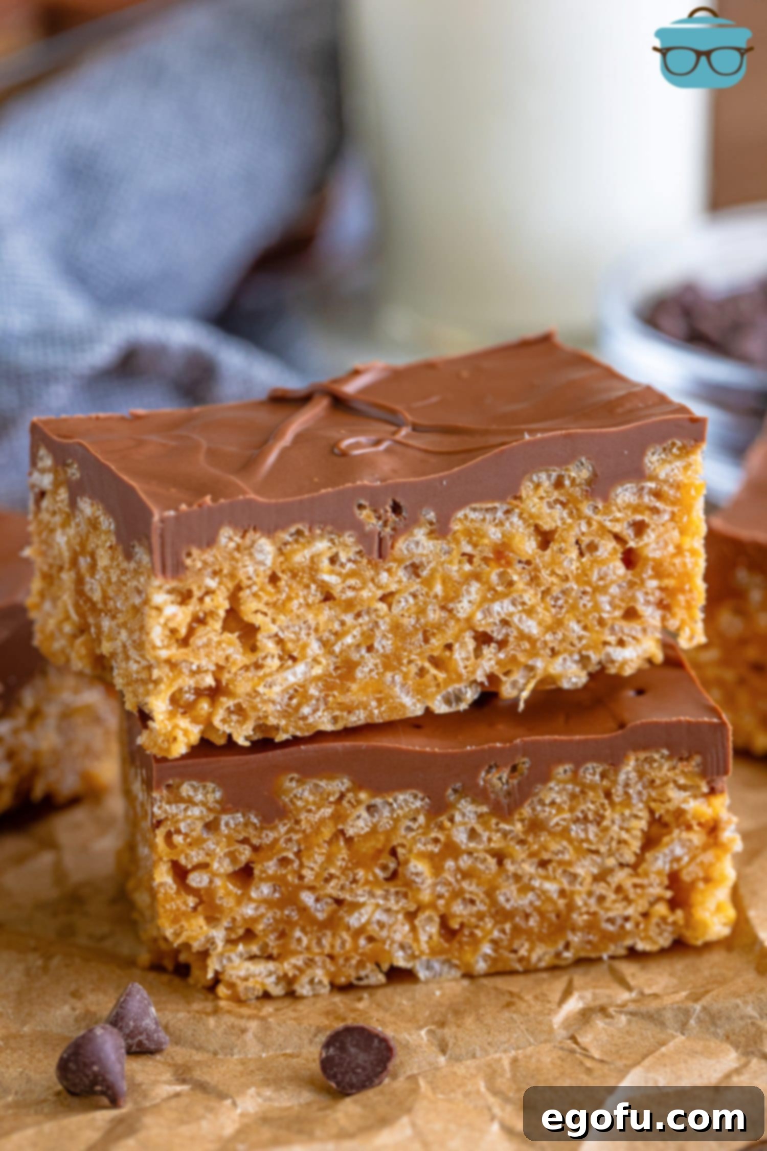 Crispy Peanut Butter Dream Bars 14 Two perfectly cut Scotcheroos in a mini pile.