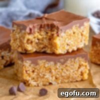 Crispy Peanut Butter Dream Bars 15 Two Scotcheroos on top of each other, the top one missing a bite.