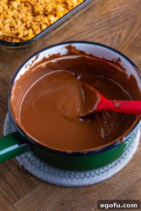 Crispy Peanut Butter Dream Bars 23 A pan of melted butterscotch and chocolate chips.