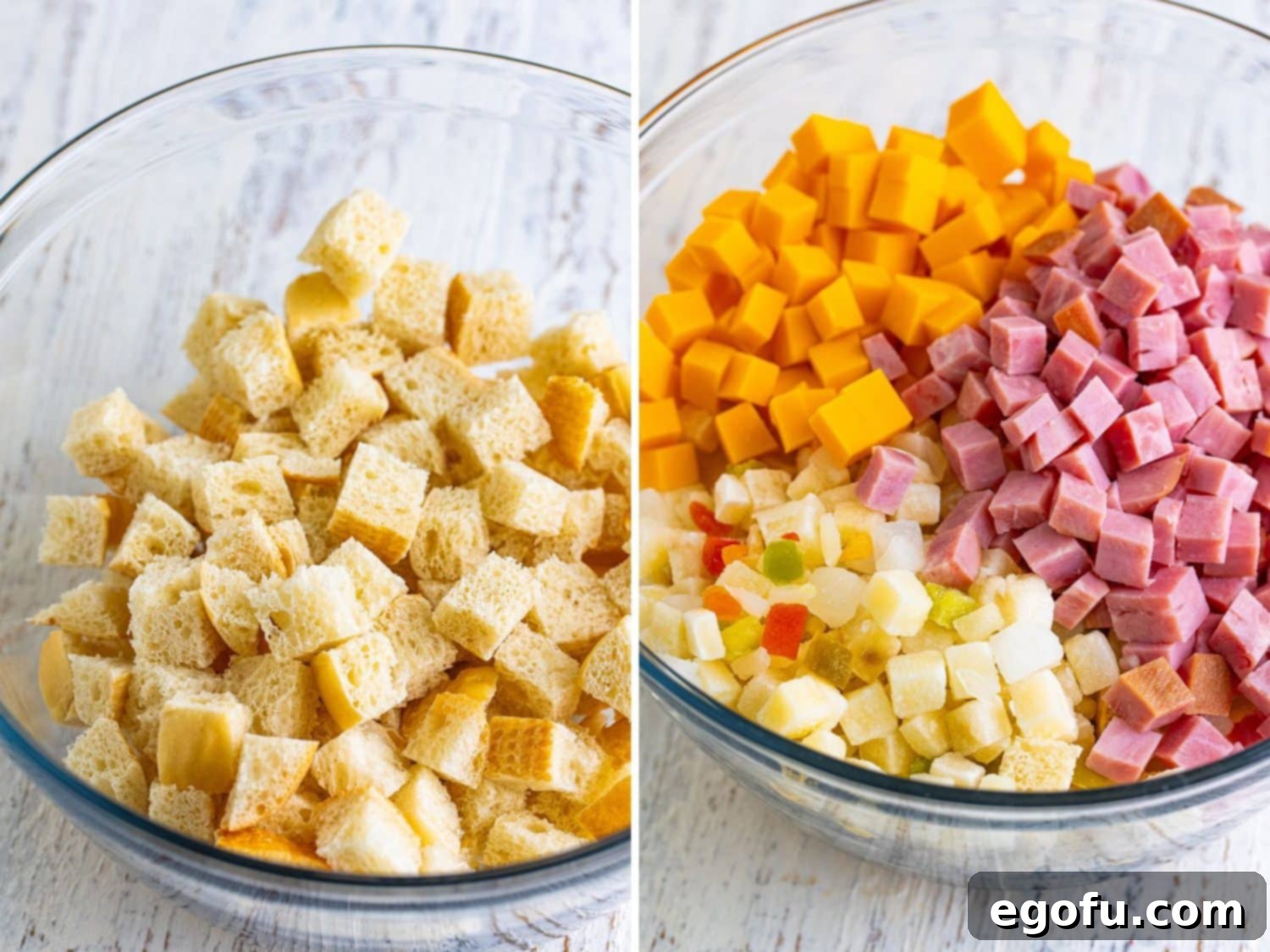 A large bowl containing an even mixture of cubed French bread, frozen potatoes O'Brien, diced cheddar cheese, and ham.
