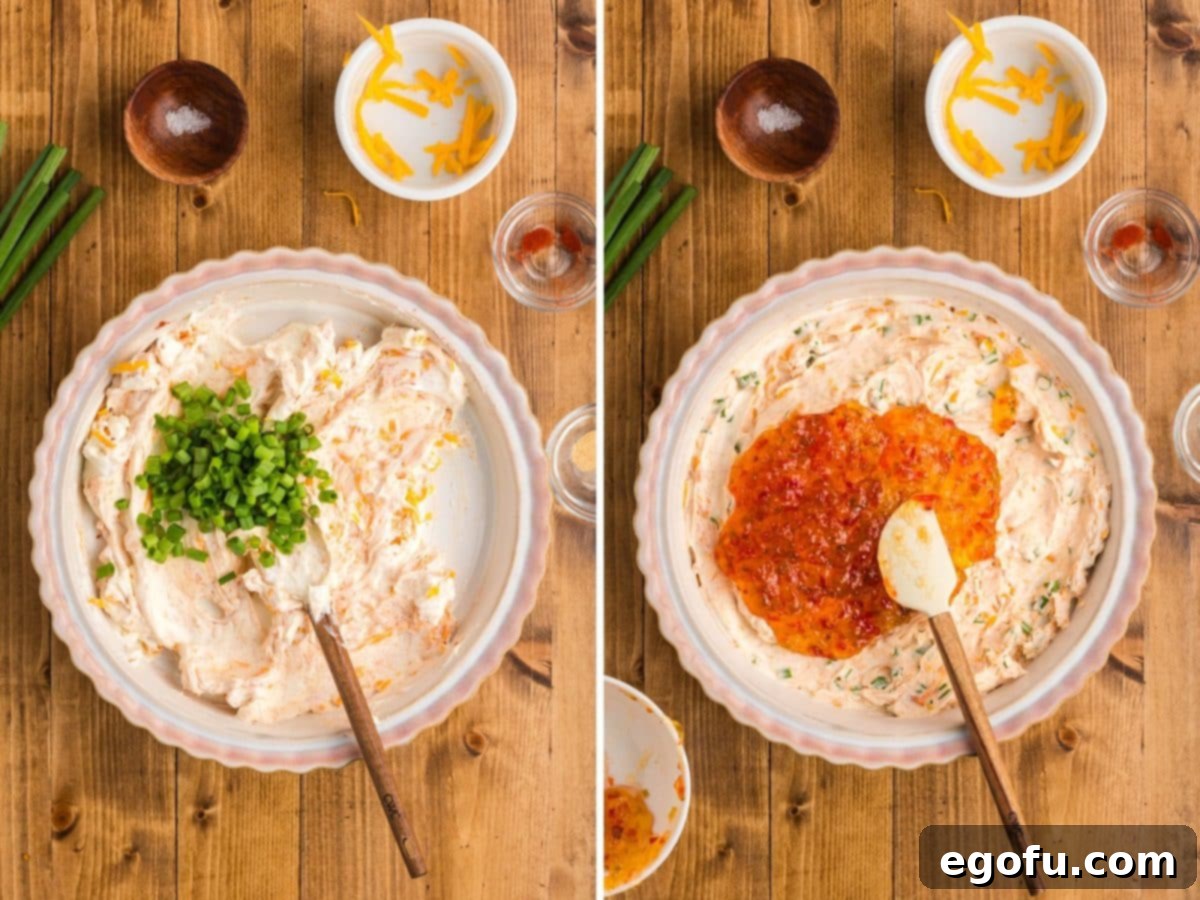 Fresh green onions being folded into the creamy cheese mixture, followed by the smooth application of vibrant, warmed pepper jelly over the top of the dip.