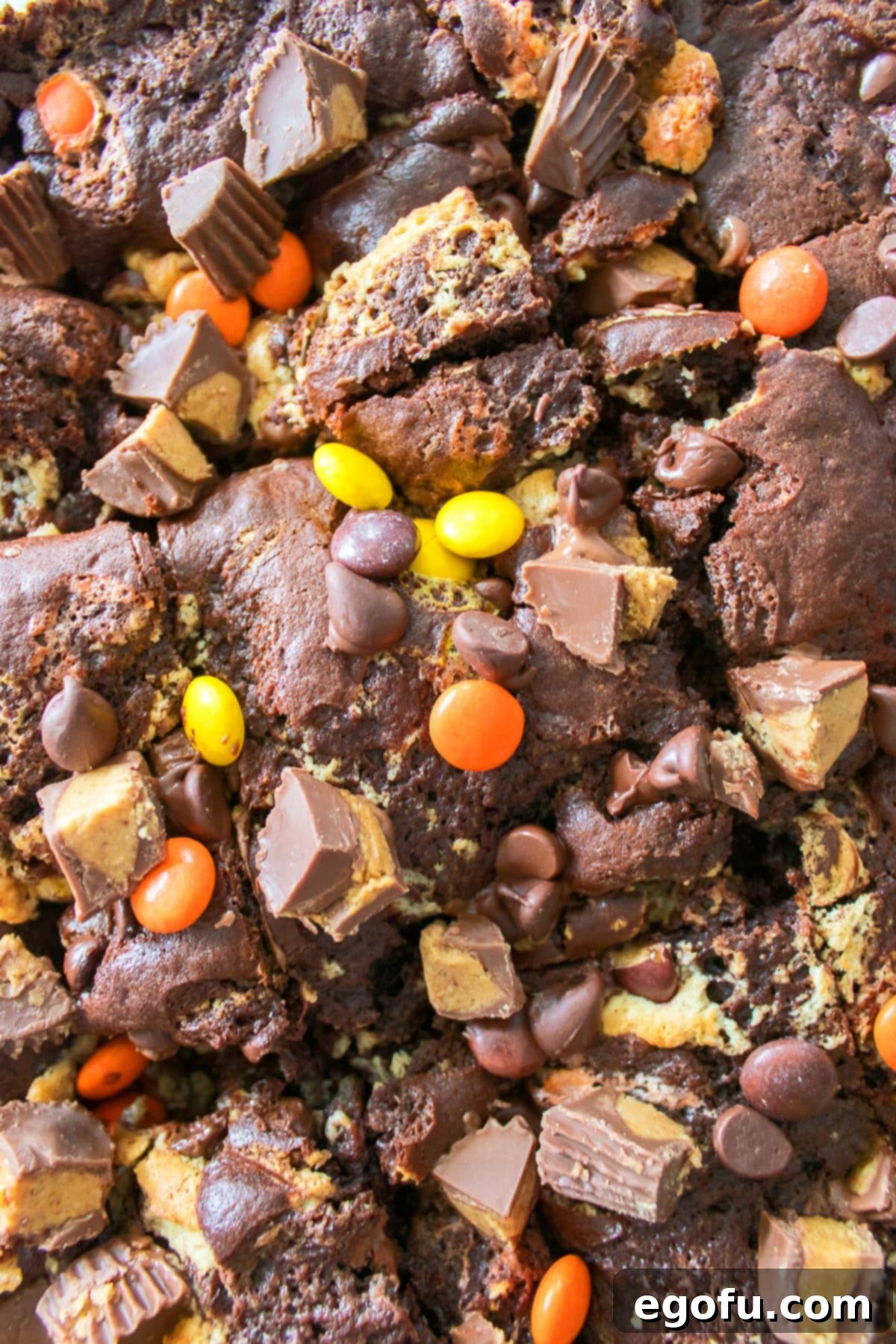 Closely looking down on a Peanut Butter Earthquake Cake, showcasing its cracked, gooey surface.