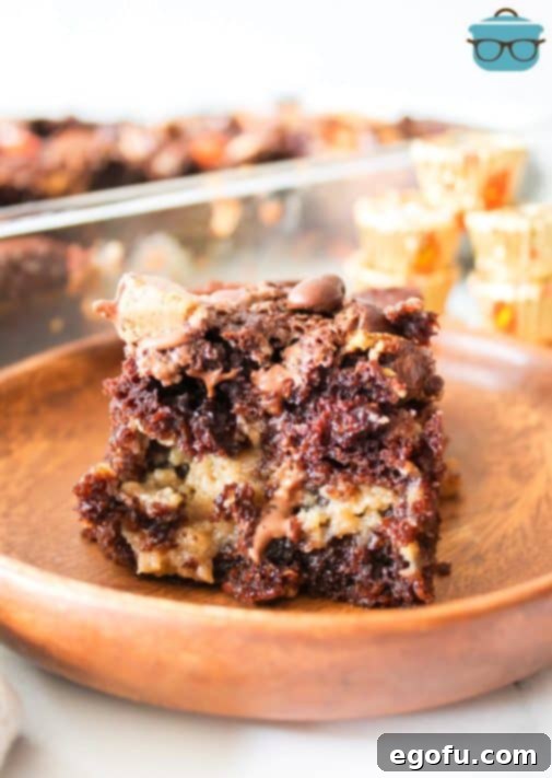 A plate with a large slice of Peanut Butter Earthquake Cake.