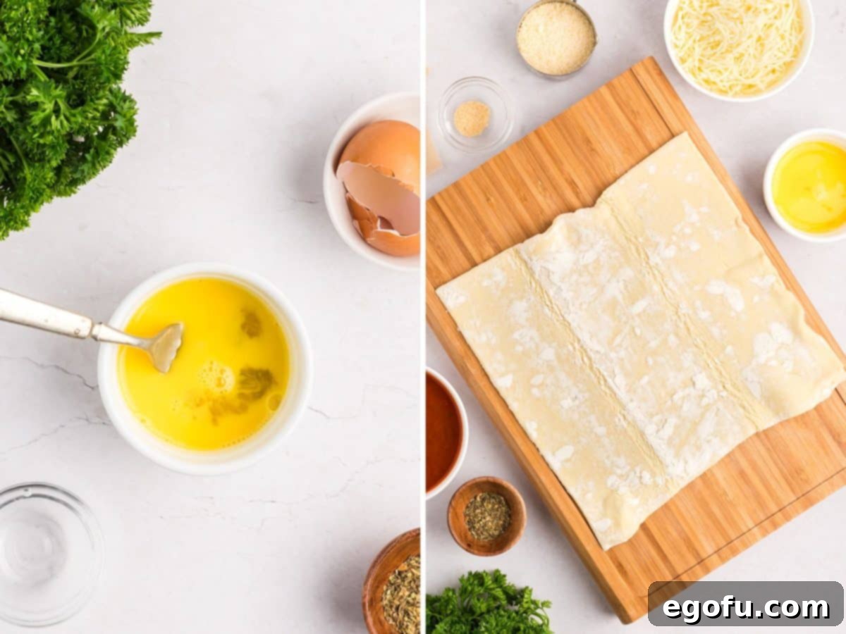 A small ramekin of egg wash next to a sheet of puff pastry unfolded on a cutting board, ready for preparation.