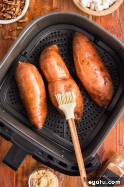 Sweet potatoes covered in olive oil.