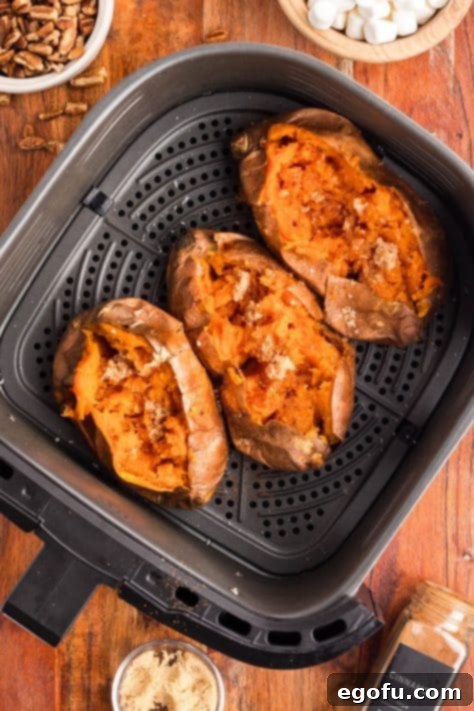Brown sugar being added to sweet potatoes.