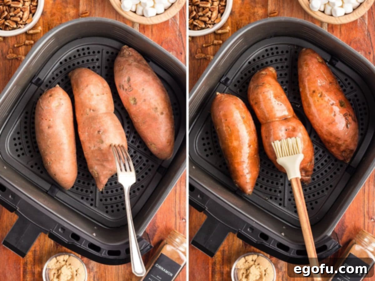 A fork poking holes in sweet potatoes and butter being brushed on them.
